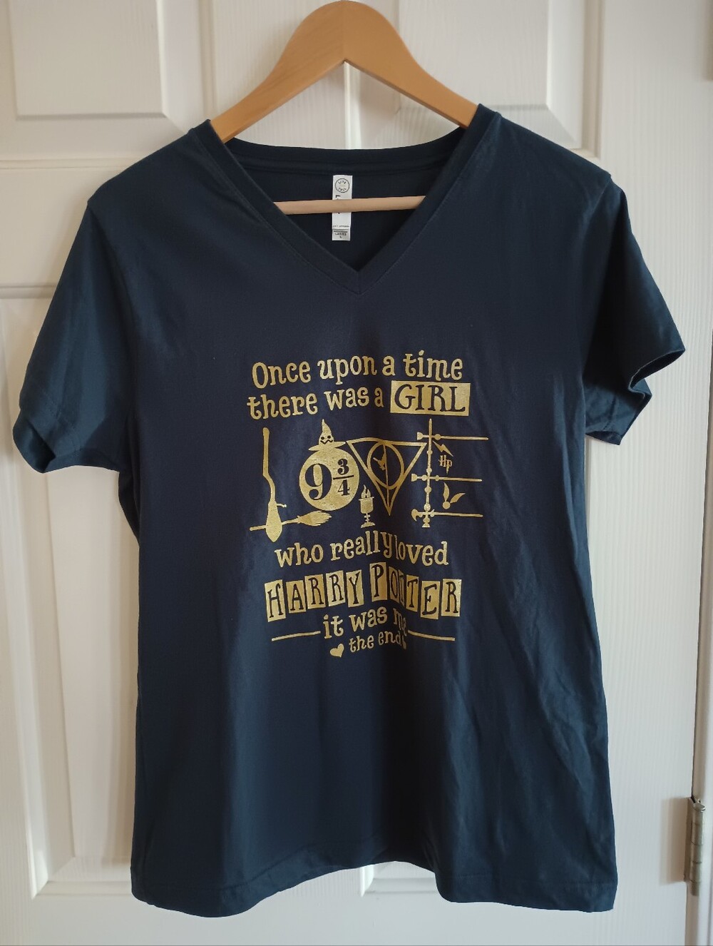 Live and Tell Harry Potter women's graphic V-neck t-shirt in Navy And Gold Large